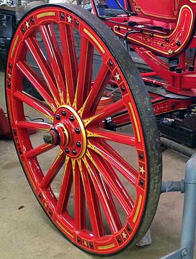 Gilded steamer wheels leaving Fire Gold shop